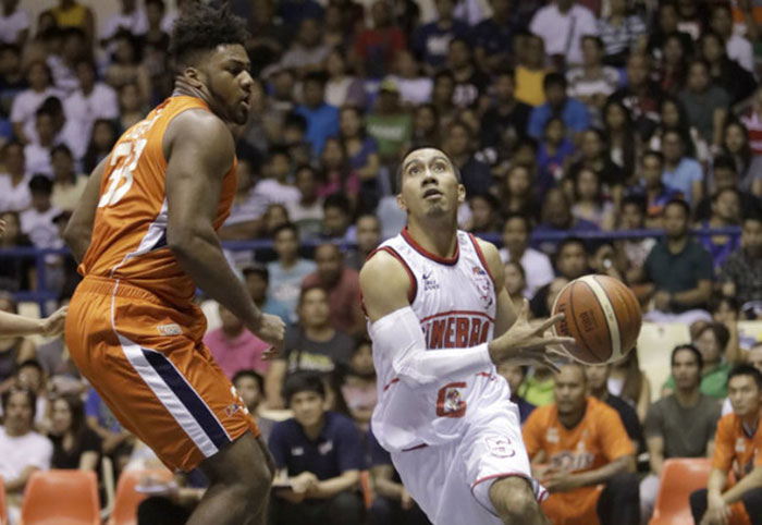 Barangay Ginebra's LA Tenorio goes up against Meralco import Alex Stepheson in their PBA Commissioner's Cup game at the Ynares Center in Antipolo City Sunday night.