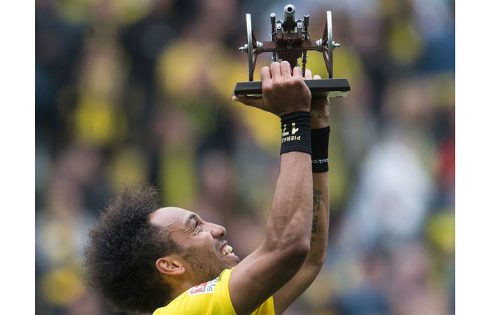 Dortmund's Pierre-Emerick Aubameyang holds the best scorer trophy after the German Bundesliga soccer match against SV Werder Bremen in Dortmund Saturday. — AP