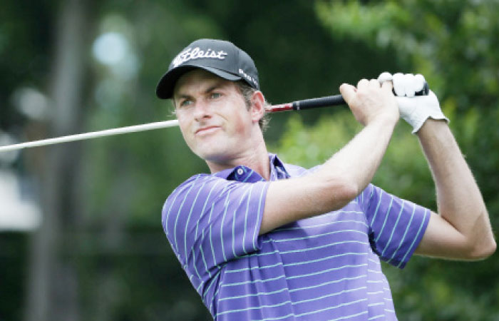Webb Simpson watches his tee shot during the third round of the Dean & DeLuca Invitational Golf Tournament in Fort Worth Saturday. — AP