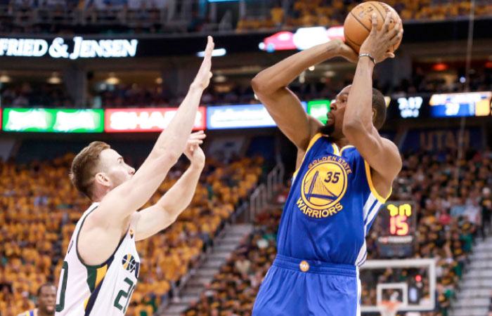 Golden State Warriors’ forward Kevin Durant shoots the ball over Utah Jazz’s forward Gordon Hayward during their NBA Playoffs at Vivint Smart Home Arena in Salt Lake City Saturday. — Reuters