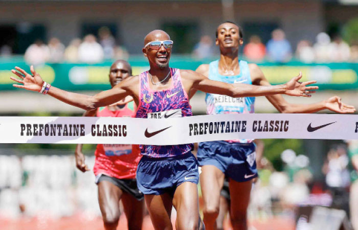 Mo Farah of Great Britain crosses the finish line to win the 5000m during the 2017 Prefontaine Classic Diamond League at Hayward Field in Eugene, Oregon, Saturday. — AFP