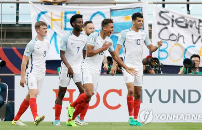 England’s players celebrate their victory over Argentina in the opening match of the 2017 Under-20 World Cup in Seoul Saturday. — AP