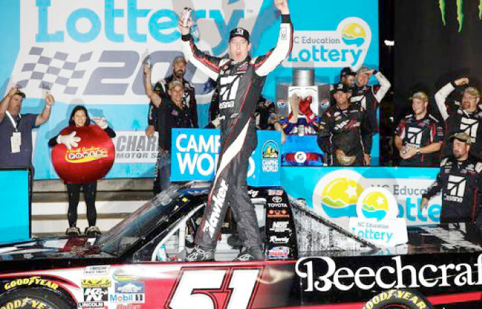 Kyle Busch celebrates his second straight NASCAR Truck Series victory at Charlotte Motor Speedway Friday night. — AP