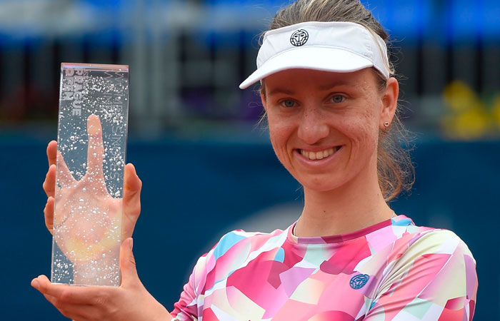German Mona Barthel poses with the trophy after winning over Czech's Kristyna Pliskova in the Prague Open final Saturday. — AFP