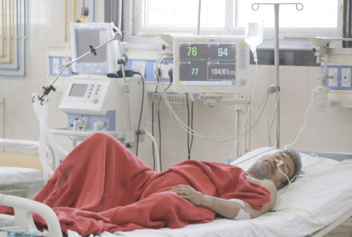 An Indian Dalit man Mauasi Ram, 55, who was attacked by a group of people while returning from a rally, recovers at a government hospital in Meerut, about 65 km New Delhi, on Wednesday. — AP