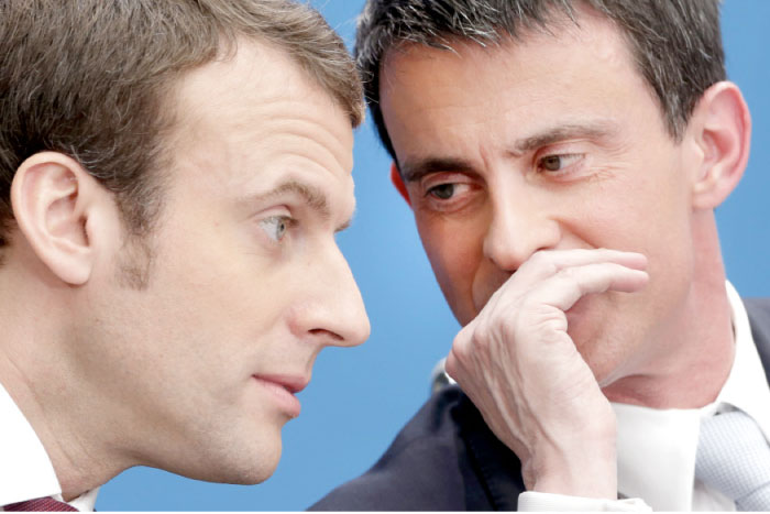 Former French Prime Minister Manuel Valls, right, speaks with French President-elect Emmanuel Macron during a meeting in Paris in this April 8, 2015 file photo. — AP