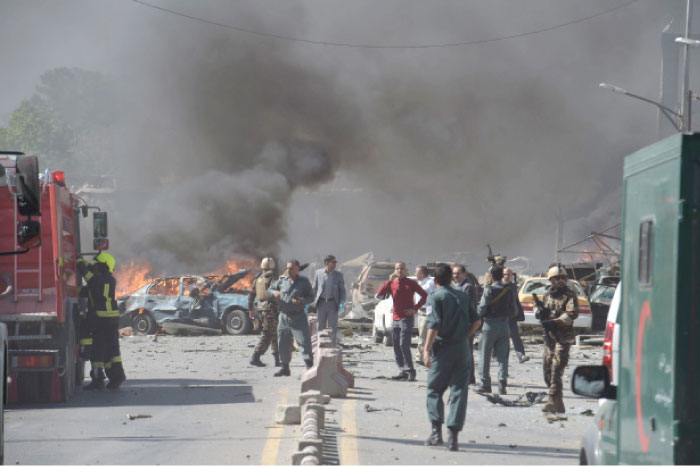 Afghan security forces arrive at the site of a car bomb attack in Kabul on Wednesday. — AFP