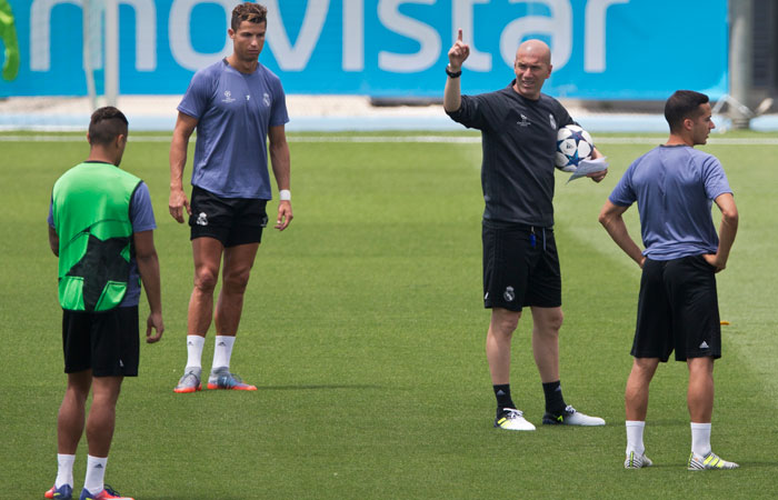 Real Madrid's head coach Zinedine Zidane, 3rd left signals next to Cristiano Ronaldo, left, during a training session at a media open day in Madrid, Tuesday. Real Madrid will play Juventus Saturday in the Champions League final in Cardiff. — AP