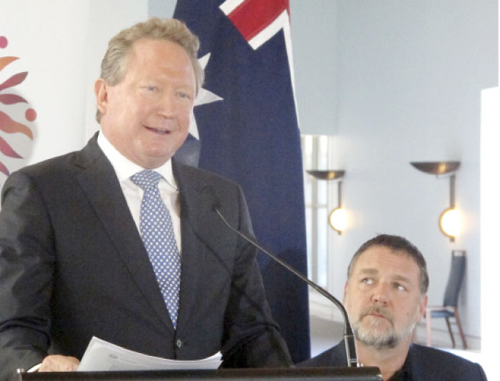 Iron ore mining magnate Andrew Forrest, left,  gives a speech at Australia›s Parliament House in Canberra, Australia, on Monday, May 22, 2017, as actor Russell Crowe looks on. — AP