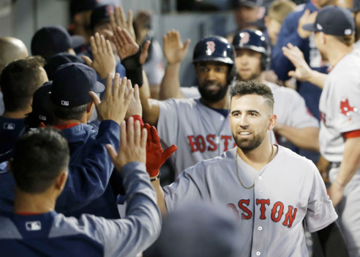 Boston Red Sox’s Deven Marrero celebrates his three-run home run off Chicago White Sox starting pitcher Jose Quintana during their MLB game in Chicago Tuesday. — AP