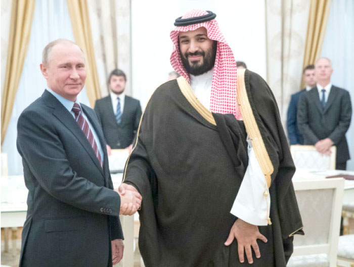 Russian President Vladimir Putin shakes hands with Deputy Crown Prince Muhammad Bin Salman, second deputy premier and minister of defense, during a meeting at the Kremlin in Moscow on Tuesday. — AFP