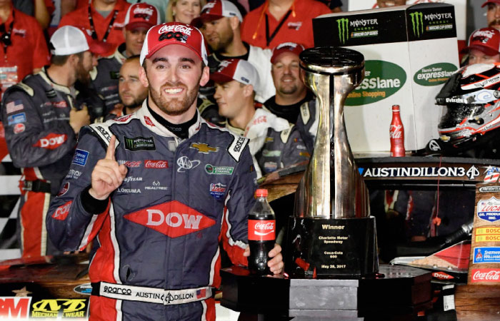 Austin Dillon, driver of the No. 3 DOW Salutes Veterans Chevrolet, poses for a photo with the trophy after winning the Monster Energy NASCAR Cup Series Coca-Cola 600 at Charlotte Motor Speedway on Sunday in Charlotte, North Carolina.— AFP