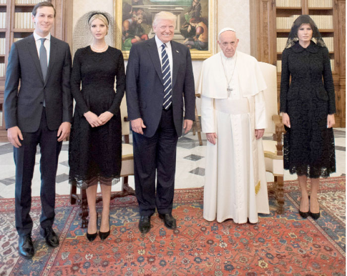 Pope Francis poses with US President Donald Trump (C) his wife Melania (R), Jared Kushner (L) and Ivanka Trump during a private audience at the Vatican on Wednesday. — Reuters