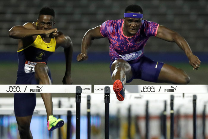 Jamaica's Omar McLeod (R) and Ronald Levy in action during the men’s 110m hurdles final of the JAAA National Senior Championships at the National Stadium in Kingston, Jamaica, Saturday. — Reuters