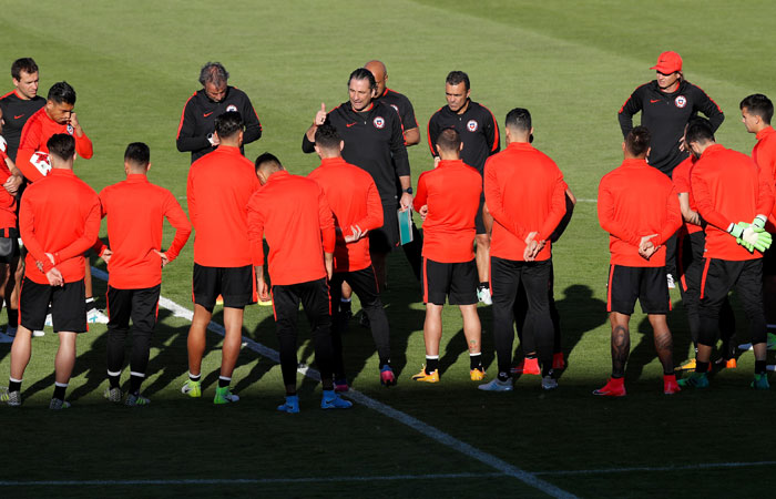 Chile coach Juan Antonio Pizzi talks to the team during training a training session at Central Stadium in Kazan Tuesday. — Reuters