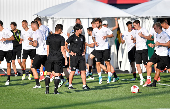 Germany coach Joachim Loew and assistant coach Miroslav Klose watch the national team exercising in Sochi, Russia, Wednesday. Germany will play Mexico in a Confederations Cup semifinal match Thursday. — AP