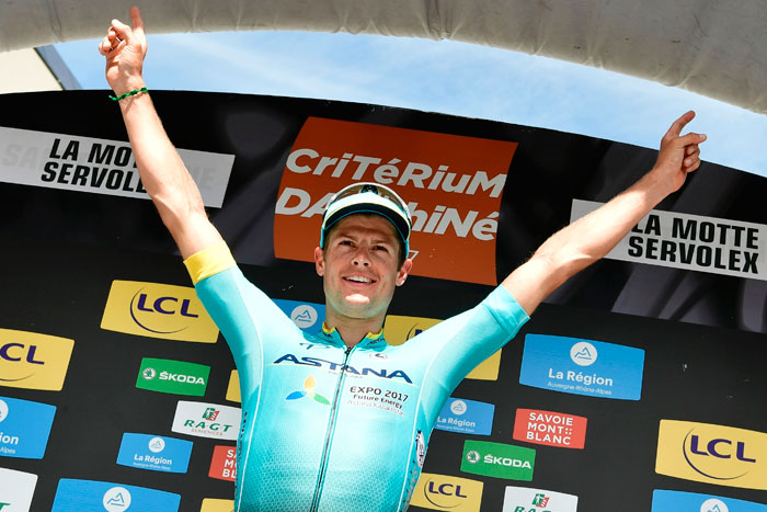 Stage winner Denmark's Jakob Diemer Fuglsang celebrates on the podium after winning the 147,5 km sixth stage of the 69th edition of the Criterium du Dauphine cycling race between Villars-les-Dombes and La Motte-Servolex. — AFP
