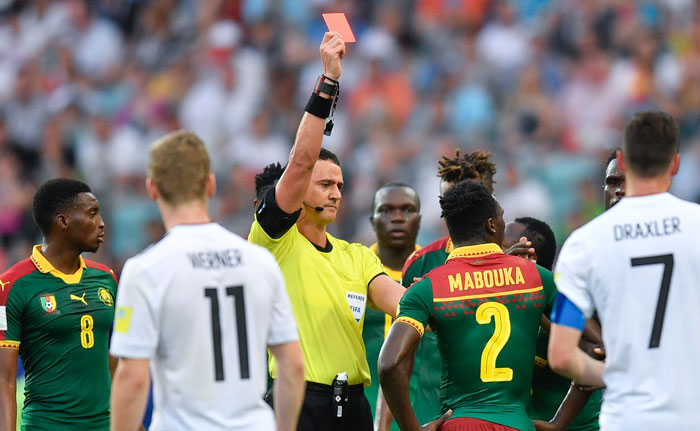 Referee Wilmar Roldan shows a red card to Cameroon's Ernest Mabouka after VAR decision during the Confederations Cup Group B match against Germany at the Fisht Stadium in Sochi, Russia, Sunday. — AP