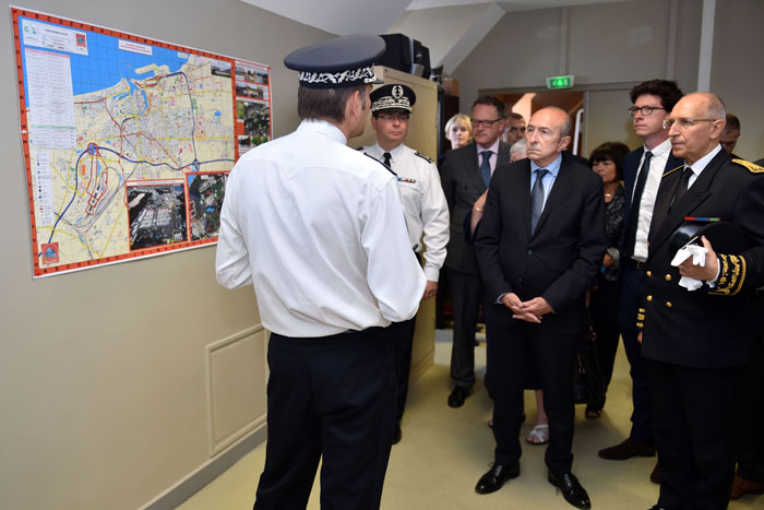 French Interior Minister Gerard Collomb (C) meets police during a visit in the French northern city of Calais on Friday. — AFP