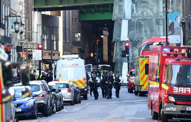 Attackers plough van into London crowd, stab revellers, kill six