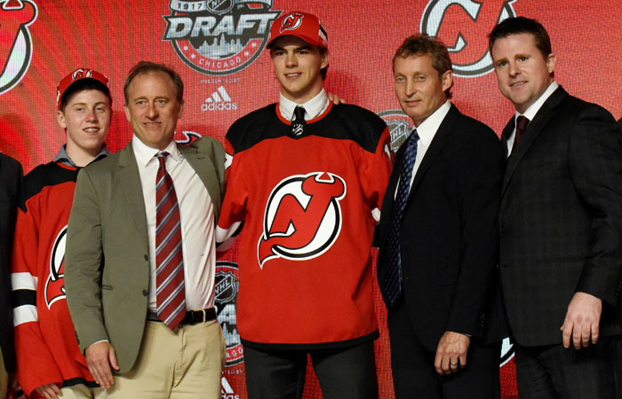Nico Hischier poses for photos after being selected as the number one overall pick to the New Jersey Devils in the first round of the 2017 NHL Draft at United Center in Chicago Friday. — Reuters