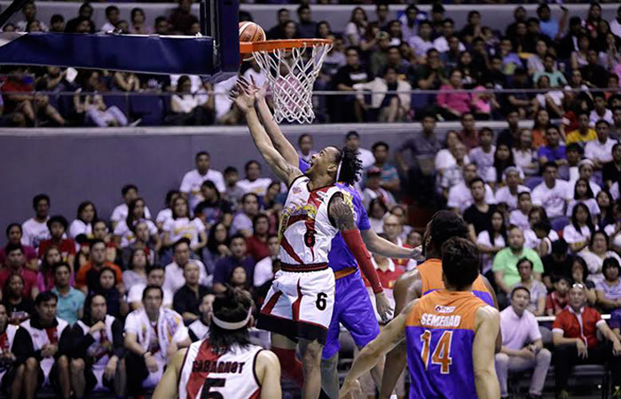 SMB's Chris Ross goes up for a layup against TNT’s Ryan Reyes in Game 3 of the PBA Commissioner's Cup Finals at the Smart-Araneta Coliseum Sunday night.