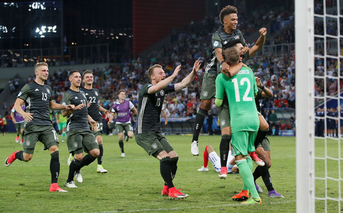 Germany's players celebrate after winning the penalty shootout during the Euro U21 semifinal match against England in Tychy, Poland, Tuesday. — Reuters