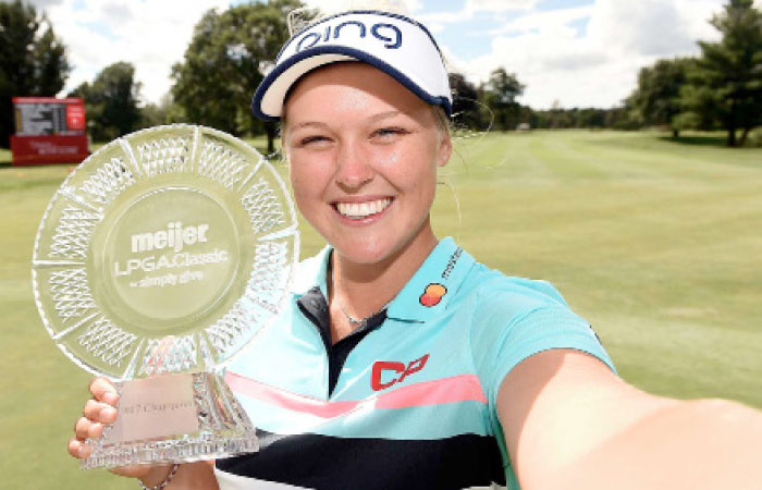 Brooke Henderson holds the Meijer LPGA Classic Trophy. — AFP