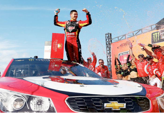 Kyle Larson, driver of the #42 Cars 3/Target Chevrolet, celebrates in Victory Lane after winning the Monster Energy NASCAR Cup Series FireKeepers Casino 400 at Michigan International Speedway Sunday. — AFP