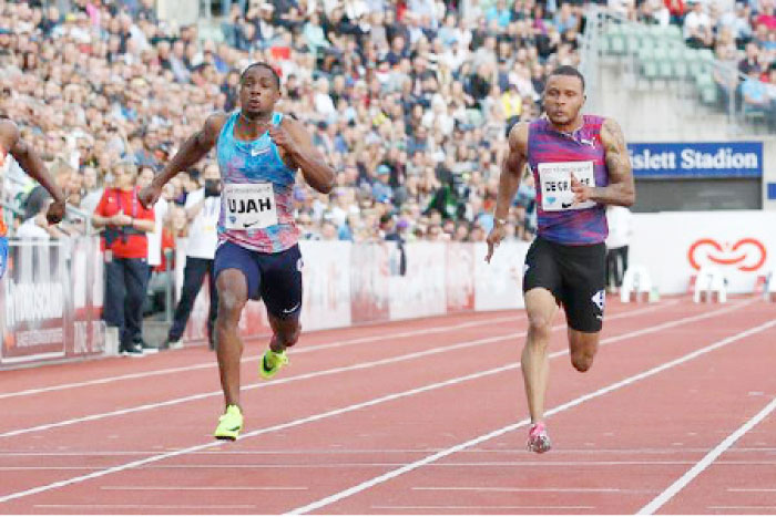Canada’s triple Olympic medalist André De Grasse (R) heading for victory in the 100m at the Oslo Diamond League meeting Thursday. — AFP