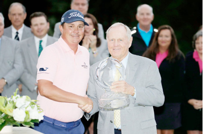 Jack Nicklaus poses with Jason Dufner on the 18th hole after the final round of the Memorial Tournament at Muirfield Village Golf Club on Sunday in Dublin, Ohio. — AFP