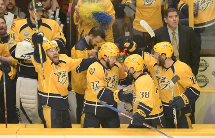 Members of the Nashville Predators react after the officials announce Nashville Predators center Frederick Gaudreau (32) scored a goal against the Pittsburgh Penguins during the second period in game four of the 2017 Stanley Cup Final at Bridgestone Arena. — Reuters