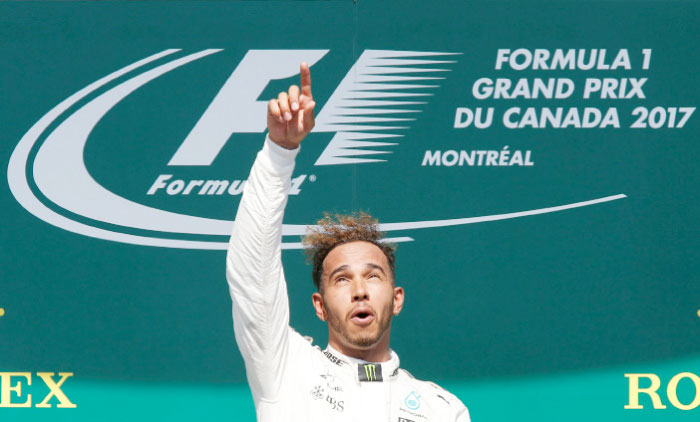 Mercedes’ Lewis Hamilton celebrates after winning the Canadian Grand Prix F1 race on the podium in Montreal, Quebec, Canada on Sunday. — Reuters