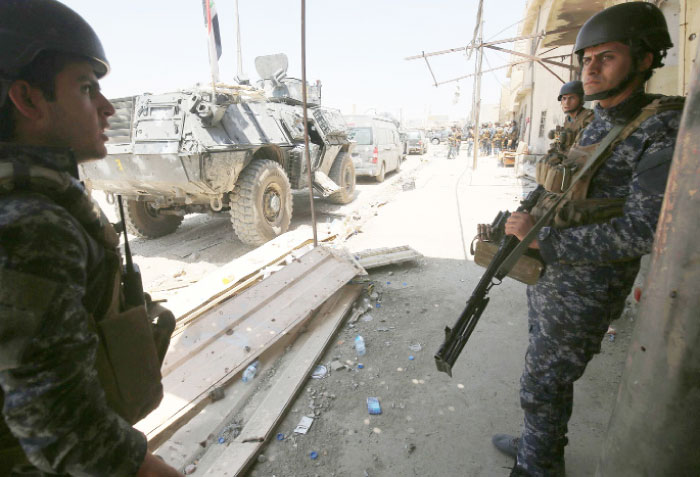 Iraqi forces patrol as they advance towards the Old City of Mosul during an ongoing offensive to retake the last district still held by the Daesh group fighters. — AFP