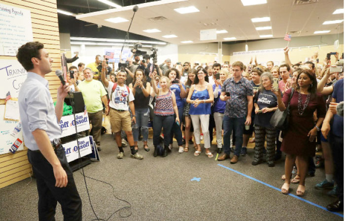 Democratic candidate Jon Ossoff speaks to volunteers and supporters on the last night before election day as he runs for Georgia’s 6th Congressional District in Roswell, Georgia, on Monday. — AFP