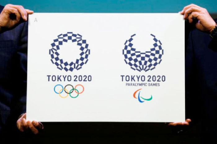 Tokyo 2020 Emblems Selection Committee Chairperson Ryohei Miyata (R) and committee member Sadaharu Oh present the winning design of the Tokyo 2020 Olympic Games and Paralympic Games during its unveiling ceremony in Tokyo, Japan, on April 25, 2016. — Reuters
