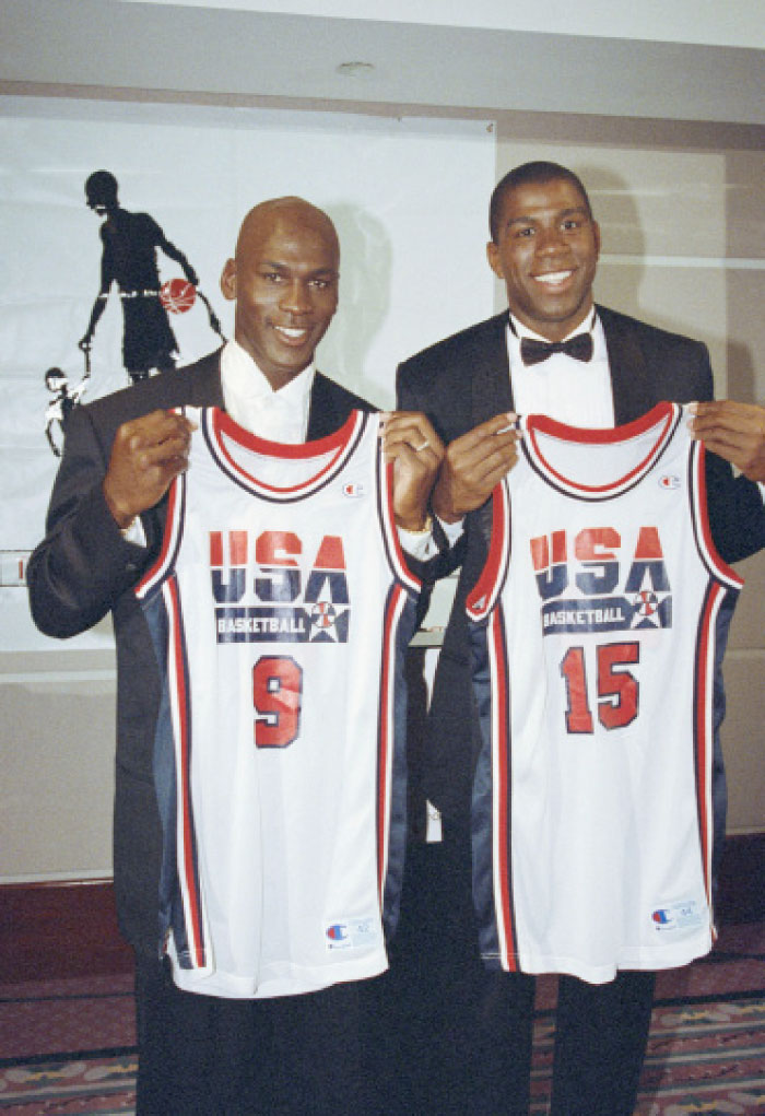 FILE - This Sept. 21, 1991 file photo shows Michael Jordan, left, and Earvin «Magic» Johnson holding their uniforms for the 1992 US Olympic Basketball team in Chicago. Cleveland Cavaliers star LeBron James knows who his dream teammates would be in a 3-on-3 competition at the 2020 Olympics _ Michael Jordan and Magic Johnson. James didn’t think he would consider playing in the new Olympic event in the Tokyo Games, but is happy it was added. (AP Photo/Ralf-Finn Hestoft, file)