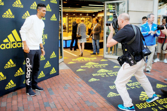 South African sprinter Wayde van Niekerk poses for photographs as he arrives for a gathering of athletes competing in the Boston Games street meet in Boston, Massachusetts, US. — Reuters