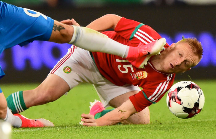 Hungary's Laszlo Kleinheisler (R) fights for the ball with Russia's Fyodor Smolov (L) during a friendly football match between Hungary and Russia  at Groupama Arena of Budapest on Monday. — AFP