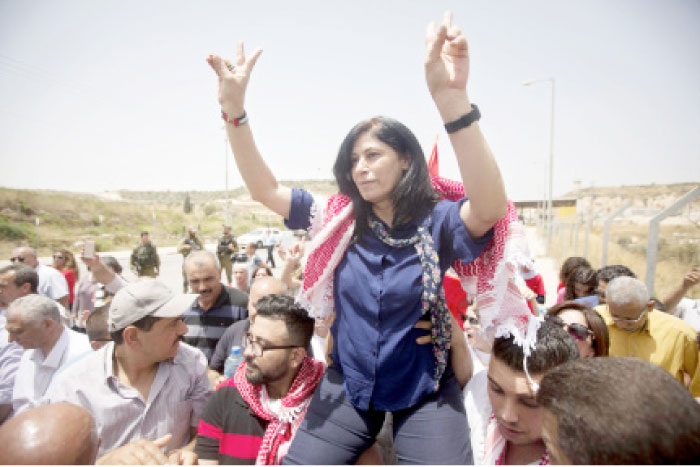 In this June 3, 2016 file photo, Palestinian lawmaker Khalida Jarrar is greeted by supporters after her release from an Israeli prison at the Jabara checkpoint near the West Bank town of Tulkarem. — AP
