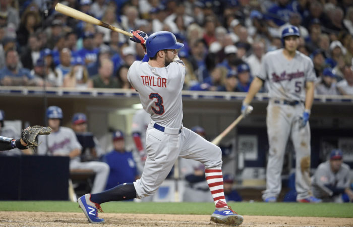 Chris Taylor of the Los Angeles Dodgers hits a grand slam during the seventh inning of their MLB game against the San Diego Padres at PETCO Park in San Diego Saturday. — AFP